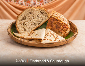 Sourdough and flatbread in a bamboo basket lined with banana leaf. Cuseho grazing tables and platters catering, Singapore