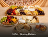 Artisanal grazing spread with cheese platter, breads, jams and fresh fruit. Cuseho grazing tables and platters catering, Singapore