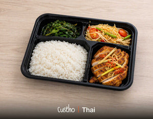 Thai bento box with lemongrass grilled chicken, jasmine rice, green papaya salad and crispy Thai basil. Cuseho Asian fusion bento catering, Singapore