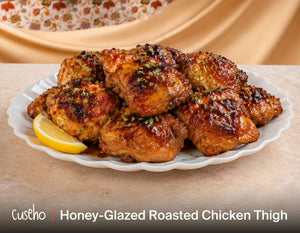 Honey glazed roasted chicken thighs with a lemon wedge. Cuseho Chinese fusion mini buffet catering, Singapore