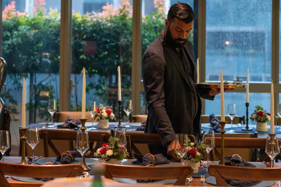 Cuseho team serving a candle-lit corporate dinner in Singapore