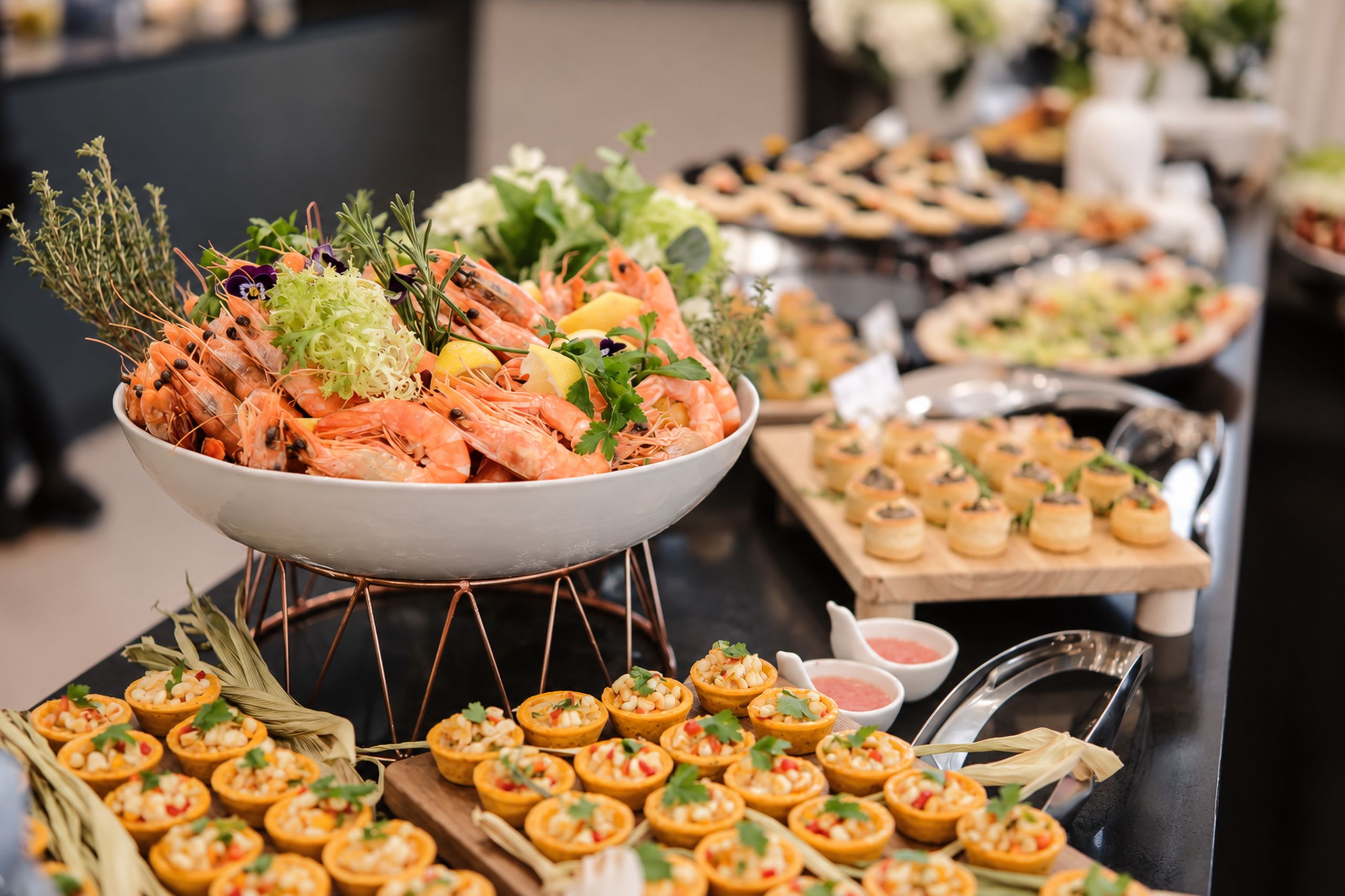 Full-service buffet with seafood and canapes set up by Cuseho
