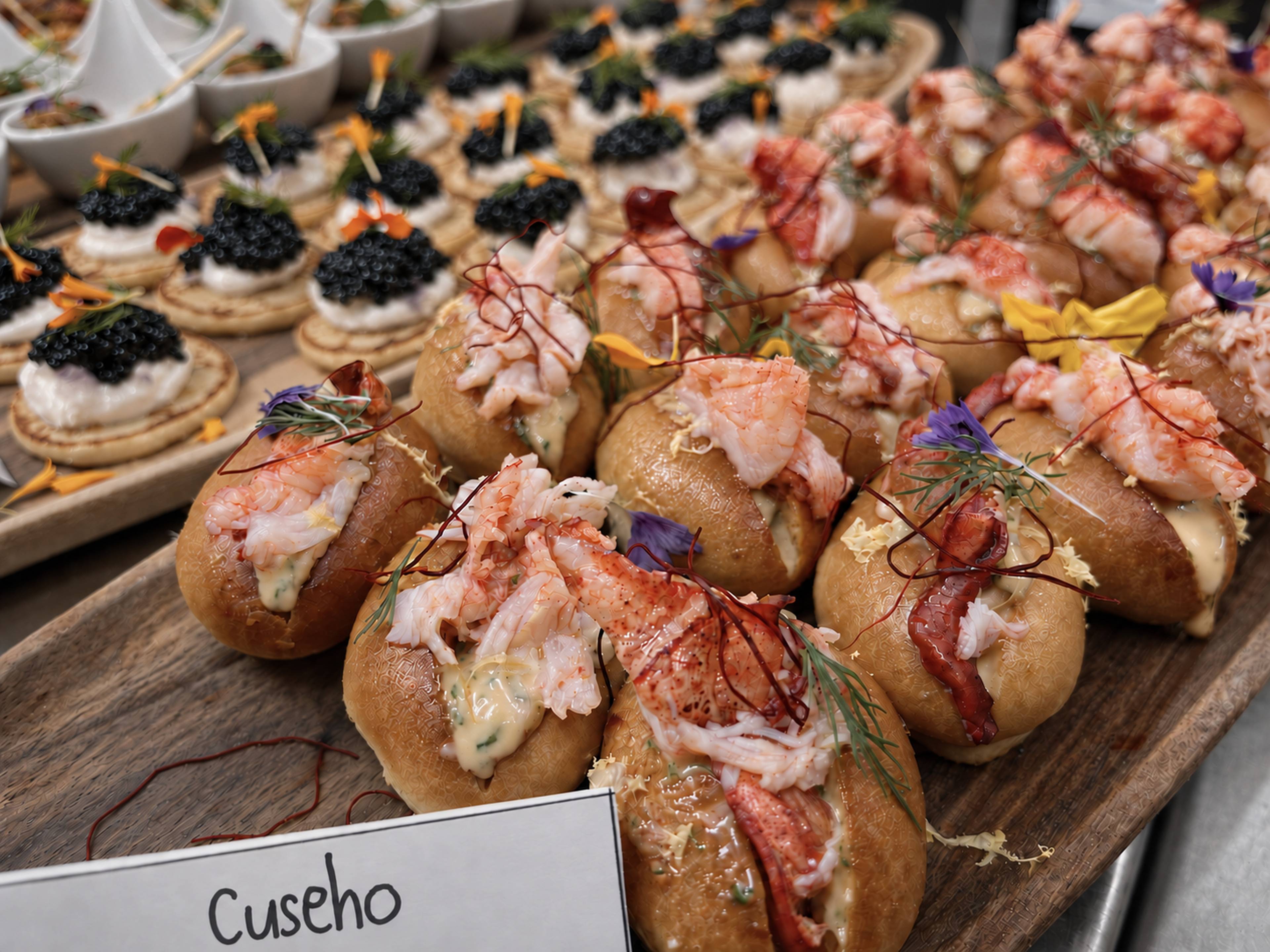 Mini lobster rolls and caviar canapes at a Cuseho live station