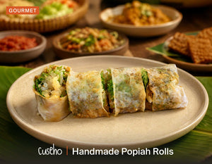 Handmade Popiah Rolls, thin crepe skin rolls, braised turnip, crisp greens, sliced to serve. Cuseho Local Delight buffet catering, Singapore