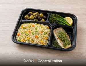 Coastal Italian bento box with baked seabass in salsa verde, garden pilaf rice, grilled broccolini and marinated olives. Cuseho Modern Western bento catering, Singapore