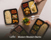 Four Modern Western bento boxes laid out for a corporate lunch, each with grain, protein, salad and side compartments. Cuseho Modern Western bento catering, Singapore