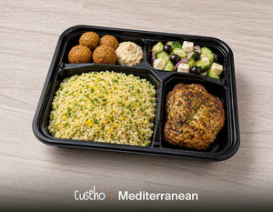 Mediterranean bento box with herb roasted chicken thigh, lemon couscous, feta and cucumber salad and golden chickpea fritters. Cuseho Modern Western bento catering, Singapore