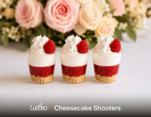 Raspberry cheesecake shooters with graham crumble and whipped cream. Cuseho wedding and gala buffet catering, Singapore