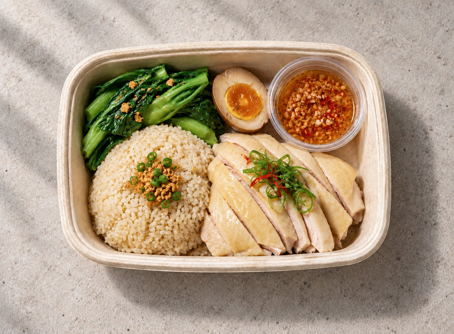 Hainanese Chicken Rice Bento in a sealed box by Cuseho